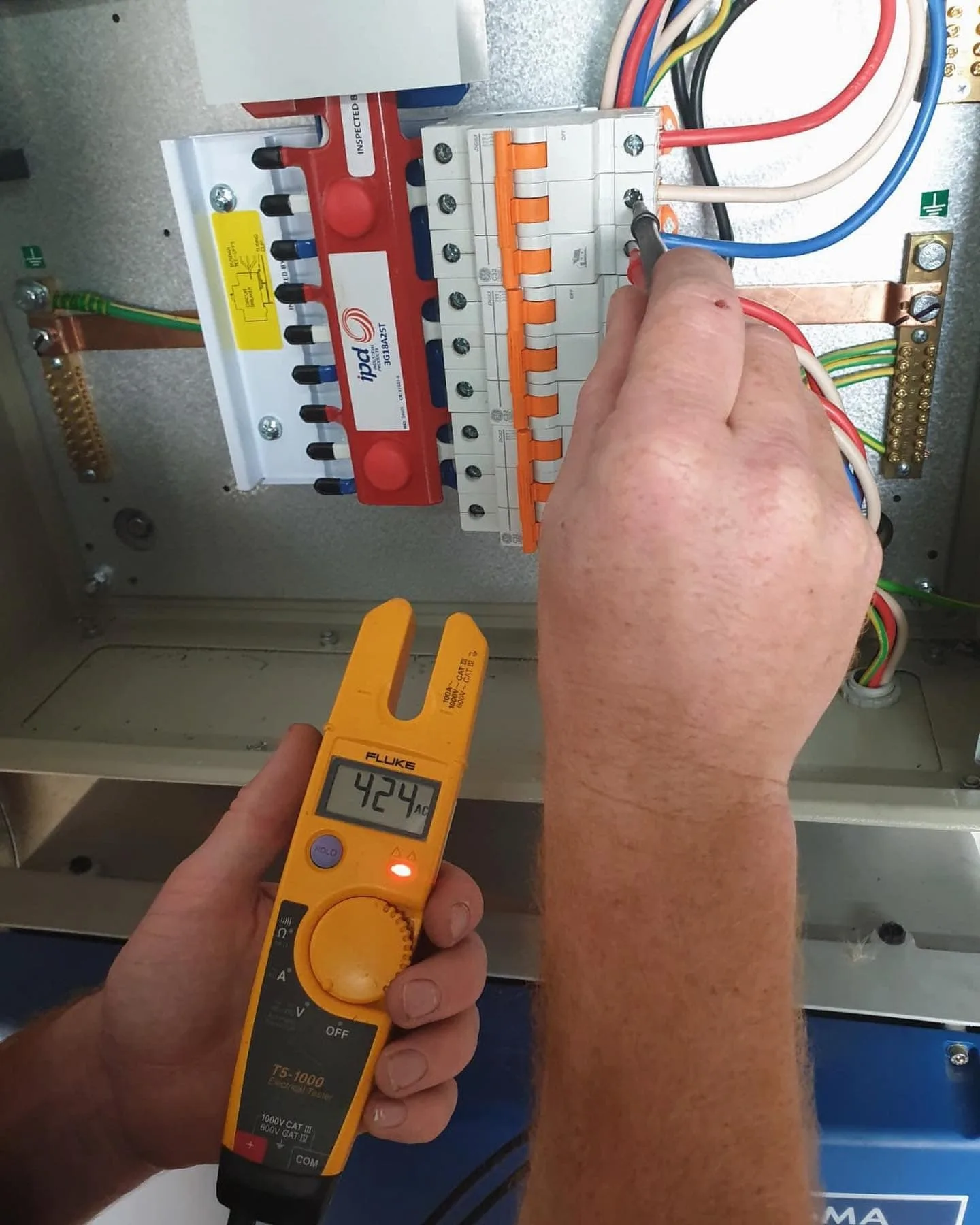 Electrician upgrading a switchboard